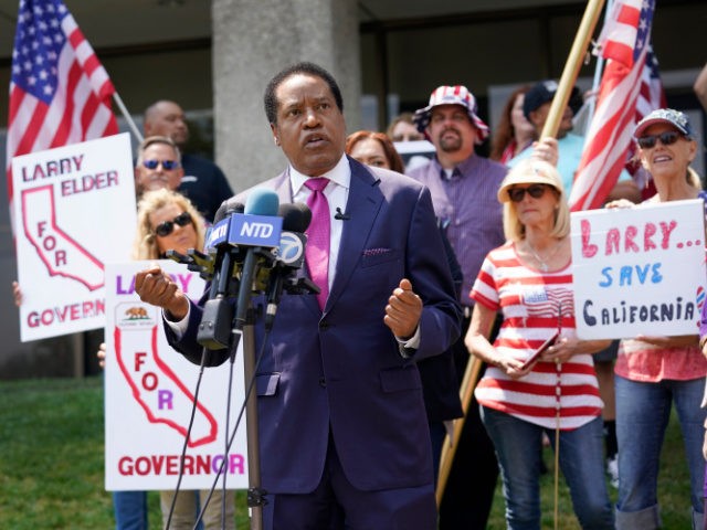 In this July 13, 2021 file photo radio talk show host Larry Elder speaks to supporters during a campaign stop in Norwalk, Calif. Elder, in his first press conference since announcing his candidacy July 12, told reporters that if he replaces Democratic Gov. Gavin Newsom in the Sept. 14 election …