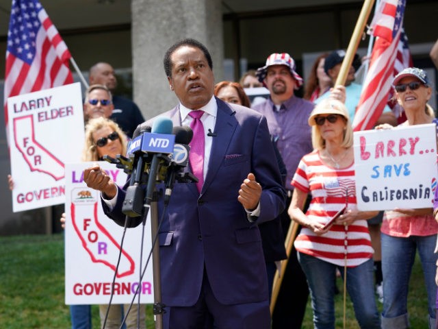 In this July 13, 2021 file photo radio talk show host Larry Elder speaks to supporters dur