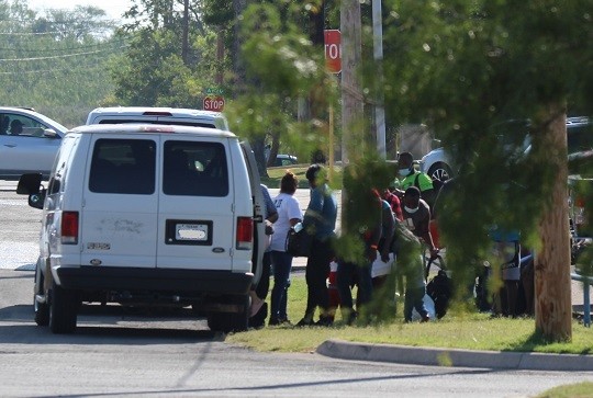 A non-profit migrant shelter group loads a group of migrants in a van in defiance of Governor Abbott's executive order banning ground transportation of migrants released by CBP. (Photo: Randy Clark/Breitbart Texas)