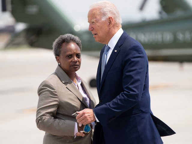 US President Joe Biden greets Chicago Mayor Lori Lightfoot (L) as he disembarks from Air Force One upon arrival at O'Hare International Airport in Chicago, Illinois, July 7, 2021, as he travels to promote his economic plans in Illinois. (Photo by SAUL LOEB / AFP) (Photo by SAUL LOEB/AFP via Getty Images)