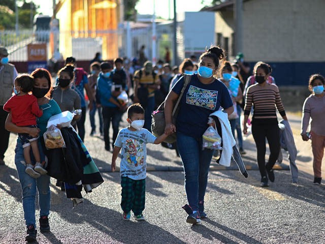Migrants arrive to El Ceibo, Guatemala on August 18, 2021, after being deported from the U