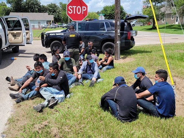 Refugio County Sheriff's Office deputies and Texas DPS troopers process a human smuggling