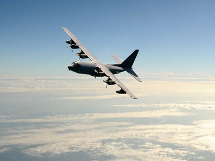 Military cargo airplane in flight at high altitude