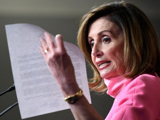 House Speaker Nancy Pelosi of Calif., holds up a letter she sent to President Donald Trump as she speaks during a news conference on Capitol Hill in Washington, Thursday, June 4, 2020. (AP Photo/Susan Walsh)