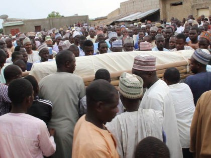 Men carry the bodies during a burial prayer held in Ngala, on December 15, 2019, of the 19 cattle herders that were gunned down by Boko Haram jihadists outside the Fuhe village, near Ngala, on December 14, 2019. - Boko Haram jihadists gunned down 19 cattle herders on December 14, …