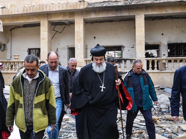 Syriac Orthodox Patriarch of Antioch, Ignatius Aphrem II, walks through the debris during his visit to the heavily damaged Syriac Orthodox church of St. Mary in Syria's eastern city of Deir Ezzor on February 3, 2018. / AFP PHOTO / Ayham al-Mohammad (Photo credit should read AYHAM AL-MOHAMMAD/AFP via Getty Images)