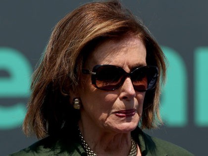 WASHINGTON, DC - AUGUST 04: House Speaker Nancy Pelosi (D-CA) listens during a rally organized by the “Paid Leave for All” cross-country bus tour on August 04, 2021 in Washington, DC. The bus tour made a stop near the U.S. Capitol Building to hold the rally along with the advocacy …