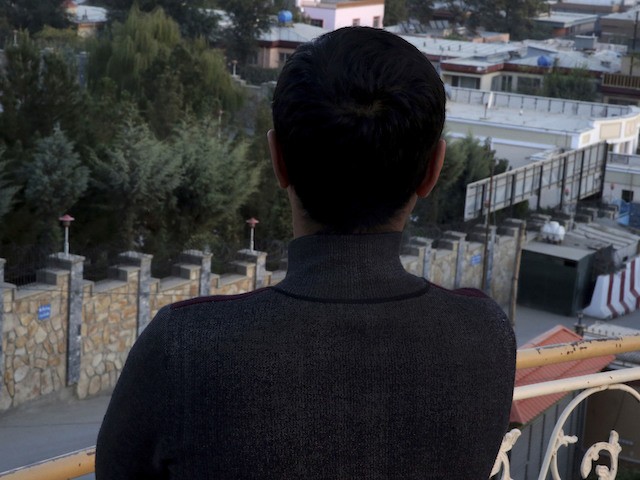 In this Monday, Oct. 16, 2016 photo, Rameen, a young gay Afghan, poses with his back to the camera in Kabul, Afghanistan. To be homosexual in Afghanistan is to live in fear. Rameen and Naveed, another young gay man, have lost count of the number of times they've been lured into dangerous situations by men they believed they were meeting for dates. Both men describe being robbed, beaten up and blackmailed, and receiving death threats; they’ve even survived police “honey traps” that could have seen them thrown in prison without charge, simply on suspicion of being gay. (AP Photos/Massoud Hossaini)