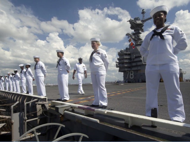 Sailors assigned to aircraft carrier Gerald R. Ford man the rails as they depart Naval Station Norfolk, Va., June 7. (MC1 Julie Matyascik:Navy)