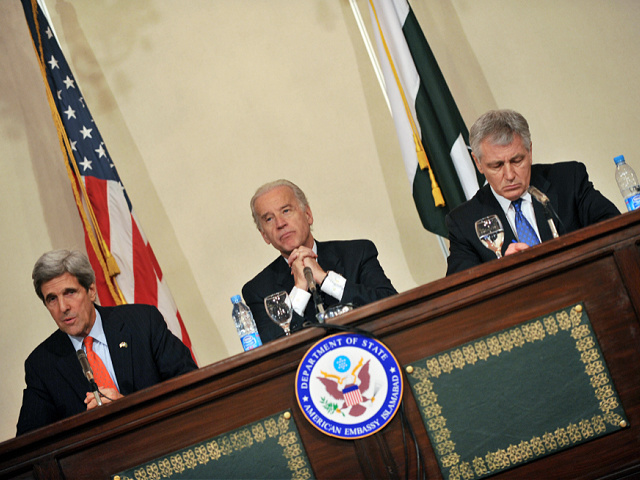 US Senators John Kerry (L) Joseph Biden (C) and Chuck Hagel (R) listen to questions from media representatives during a press conference in Islamabad on February 19, 2008. US Senator John Kerry, in Pakistan as part of a team to observe parliamentary elections, said the vote "meets the basic threshold of credibility and legitimacy." AFP PHOTO/Aamir QURESHI (Photo credit should read AAMIR QURESHI/AFP via Getty Images)
