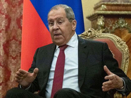 Russian Foreign Minister Sergei Lavrov speaks with the UN Special Envoy for Syria during t