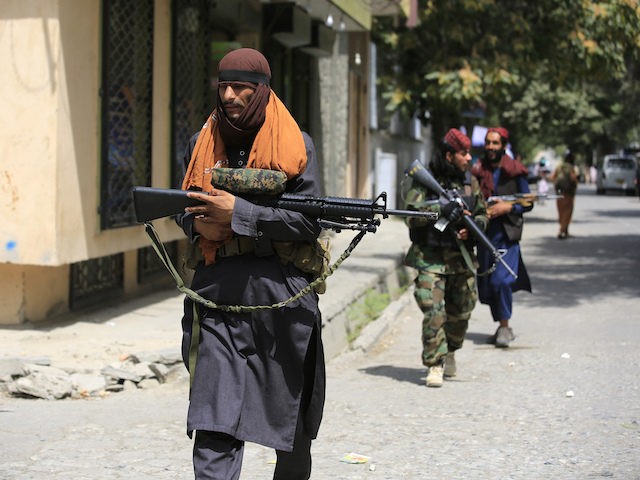 Taliban fighters patrol in Wazir Akbar Khan in the city of Kabul, Afghanistan, Wednesday, Aug. 18, 2021. The Taliban declared an "amnesty" across Afghanistan and urged women to join their government Tuesday, seeking to convince a wary population that they have changed a day after deadly chaos gripped the main …