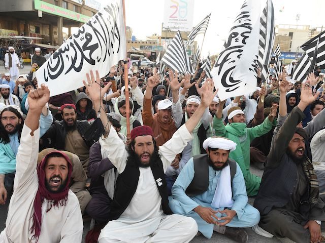 Activists of Jamiat Ulema-e Islam Nazryate party shout as they celebrate the signing agreement between the US and the Taliban during a rally in Quetta on March 1, 2020.      - The United States signed a landmark deal with the Taliban on February 29, laying out a timetable for …