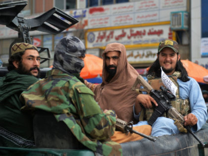 Taliban fighters patrol on a pick-up vehicle along in a street in Kabul on August 31, 2021 after the US pulled all its troops out of the country to end a brutal 20-year war -- one that started and ended with the hardline Islamist in power. (Photo by Hoshang Hashimi …