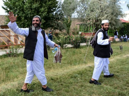 Taliban prisoners walk as they are in the process of being potentially released from Pul-e