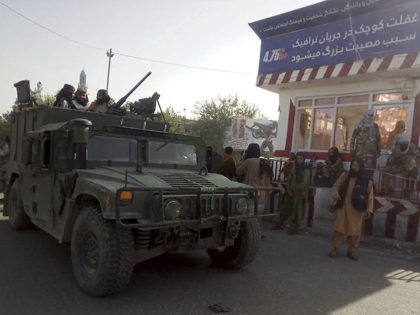 Taliban fighters stand guard at a checkpoint in Kunduz city, northern Afghanistan, Monday, Aug. 9, 2021. The militants have ramped up their push across much of Afghanistan in recent weeks, turning their guns on provincial capitals after taking district after district and large swaths of land in the mostly rural …