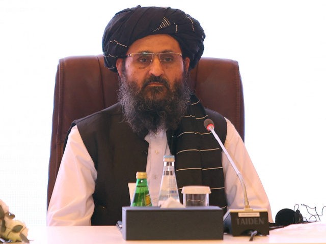 The leader of the Taliban negotiating team Mullah Abdul Ghani Baradar looks on during the