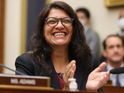 WASHINGTON, DC - JULY 20: House Financial Services Committee member Rep. Rashida Tlaib (D-MI) (R) applauds as Housing and Urban Development Secretary Marcia Fudge is introduced during a committee hearing in the Rayburn House Office Building on Capitol Hill on July 20, 2021 in Washington, DC. Fudge testified about the …