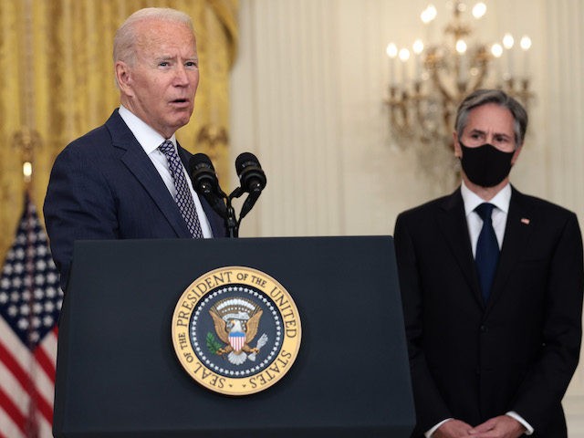 WASHINGTON, DC - AUGUST 20: U.S. President Joe Biden gestures to Secretary of State Antony Blinken as he gives remarks on the U.S. military’s ongoing evacuation efforts in Afghanistan from the East Room of the White House on August 20, 2021 in Washington, DC. The White House announced earlier that …