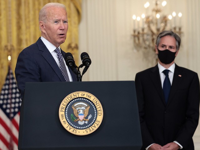 WASHINGTON, DC - AUGUST 20: U.S. President Joe Biden gestures to Secretary of State Antony Blinken as he gives remarks on the U.S. military’s ongoing evacuation efforts in Afghanistan from the East Room of the White House on August 20, 2021 in Washington, DC. The White House announced earlier that the U.S. has evacuated almost 14,000 people from Afghanistan since the end of July. (Photo by Anna Moneymaker/Getty Images)