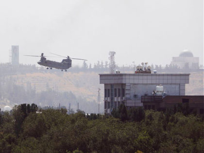 A U.S. Chinook helicopter flies near the U.S. Embassy in Kabul, Afghanistan, Sunday, Aug.