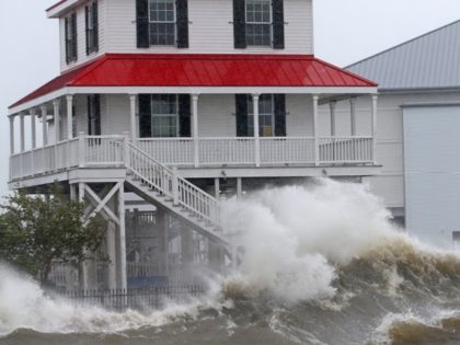 Waves crash against the New Canal Lighthouse on Lake Pontchartrain as the effects of Hurri