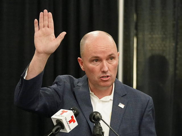 Utah Gov. Spencer Cox speaks during a news conference before receiving his first dose of t