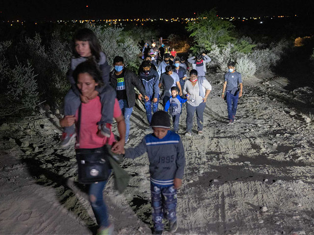 ROMA, TEXAS - AUGUST 14: Immigrants walk towards a U.S. Border Patrol checkpoint after they crossed the Rio Grande from Mexico on August 14, 2021 in Roma, Texas. Recent U.S. Customs and Border Protection figures show more than 200,000 people were apprehended at the border in July, the highest number …