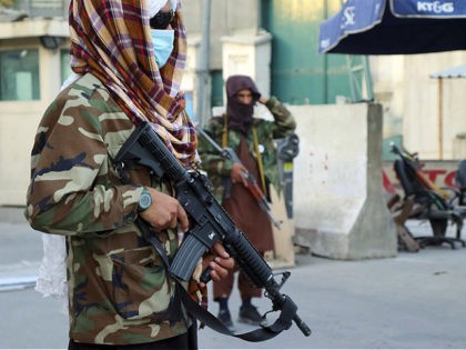 Taliban fighters stand guard at a checkpoint in Kabul, Afghanistan, Wednesday, Aug. 25, 20
