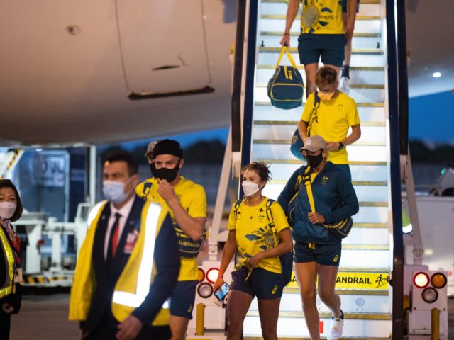 SYDNEY, AUSTRALIA - AUGUST 01: Australian Olympians exit their plane after returning from the Tokyo 2020 Olympic Games, at Sydney International Airport on August 01, 2021 in Sydney, Australia. (Photo by Jenny Evans/Getty Images)