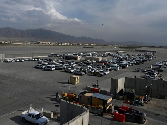 US vehicles sit in a parking lot inside the Bagram US air base after all US and NATO troop