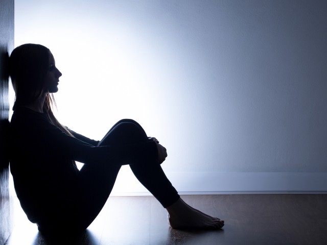 My life is such a mess - stock photo Teenager with depression sitting alone in dark room