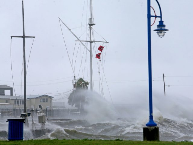 Hurricane flags at the Southern Yacht Club are whipped in the wind on Lake Pontchartrain a