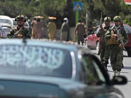 Taliban Fateh fighters, a "special forces" unit, patrol along a street in Kabul on August 29, 2021, as suicide bomb threats hung over the final phase of the US military's airlift operation from Kabul, with President Joe Biden warning another attack was highly likely before the evacuations end. (Photo by …