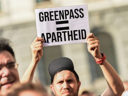 Protesters take part in a demonstration in Milan on July 24, 2021, against the introduction of a mandatory 'green pass' for indoor dining and entertainment area, in the aim to limit the spread of the Covid-19. - Italy on July 22 said a health pass would be mandatory for people …