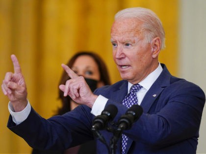 President Joe Biden answers questions from members of the media as he speaks about the evacuation of American citizens, their families, SIV applicants and vulnerable Afghans in the East Room of the White House, Friday, Aug. 20, 2021, in Washington. Vice President Kamala Harris stands at left. (AP Photo/Manuel Balce …