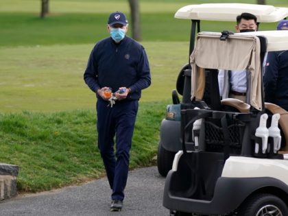 US President Joe Biden leaves his cart after a round of golf at Wilmington Country Club in Wilmington, Delaware, on April 17, 2021. - President Joe Biden played golf for the first time in his presidency Saturday, hitting the fairways in his home city of Wilmington. (Photo by JIM WATSON …