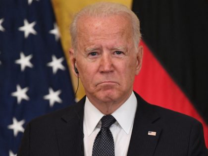 US President Joe Biden listens to German Chancellor Angela Merkel (off frame) during a joint press conference in the East Room of the White House in Washington, DC, July 15, 2021. - Chancellor Angela Merkel on Thursday visited the White House in her diplomatic swan song, a trip underlining how …