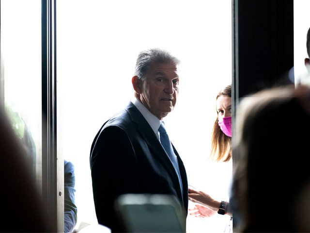 WASHINGTON, DC - JULY 28: Sen. Joe Manchin (D-WV) speaks to reporters after a lunch with Senate Democrats at the U.S. Capitol on July 28, 2021 in Washington, DC. Majority Leader Schumer said the Senate plans to hold a procedural vote on the bipartisan infrastructure legislation on Wednesday evening. (Photo …