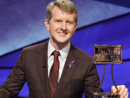 This image released by ABS shows contestant Ken Jennings with a trophy on "JEOPARDY! The Greatest of All Time." Jennings will be the first interim guest for the late Alex Trebek, and the show will try other guest hosts before naming a permanent replacement. (Eric McCandless/ABC via AP)