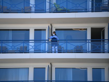 CUXHAVEN, GERMANY - MAY 23: A room cleaner disinfect a hotel balkony following the ease of