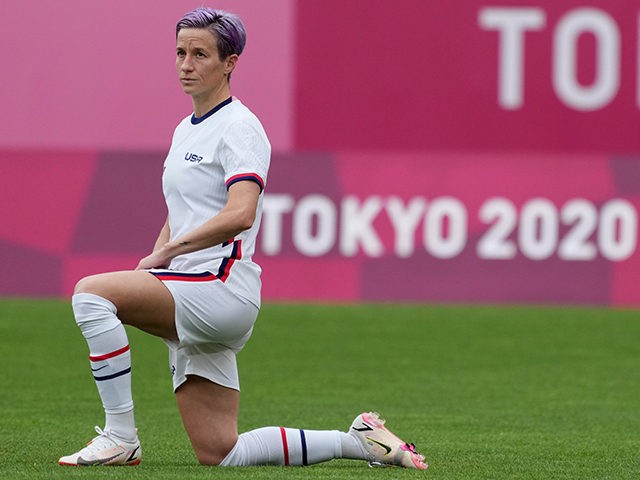 Jul 27, 2021; Ibaraki, Japan; USA player Megan Rapinoe (15) kneels before the start of the game against Australia during the Tokyo 2020 Olympic Summer Games at Ibaraki Kashima Stadium. Mandatory Credit: Jack Gruber-USA TODAY Sports