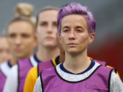 CHOFU, JAPAN - JULY 21: Megan Rapinoe #15 of Team United States reacts as she warms up prior to the Women's First Round Group G match between Sweden and United States during the Tokyo 2020 Olympic Games at Tokyo Stadium on July 21, 2021 in Chofu, Tokyo, Japan. (Photo by …