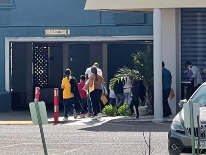 A group of migrants released by Border Patrol move into McAllen, Texas, hotel acting as an overflow shelter. (Photo: Randy Clark/Breitbart Texas)