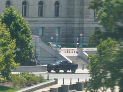 A pickup truck is parked on the sidewalk in front of the Library of Congress' Thomas Jefferson Building, as seen from a window of the U.S. Capitol, Thursday, Aug. 19, 2021, in Washington. A man sitting in the pickup truck outside the Library of Congress has told police that he …