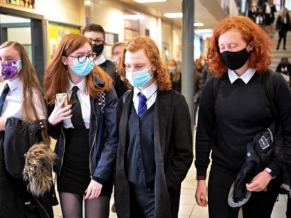 GLASGOW, SCOTLAND - AUGUST 31: Pupils at Rosshall Academy wear face coverings as it becomes mandatory in corridors and communal areas on August 31, 2020 in Glasgow, Scotland. New rules starting today require children over 12 to wear face coverings in corridors and other communal areas in schools in Scotland. …