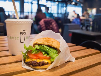 CHICAGO, IL - JANUARY 28: In this photo illustration a cheeseburger and drink is served up at a Shake Shack restaurant on January 28, 2015 in Chicago, Illinois. The burger chain, with currently has 63 locations, is expected to go public this week with an IPO priced between $17 to …