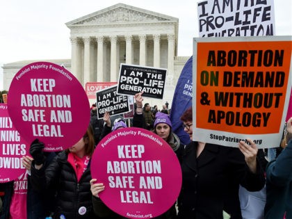 (FILES) In this file photo Pro-choice and pro-life activists demonstrate in front of the the US Supreme Court during the 47th annual March for Life on January 24, 2020 in Washington, DC. - The United States' Supreme Court on Wednesday will hear what may be its most significant case in …