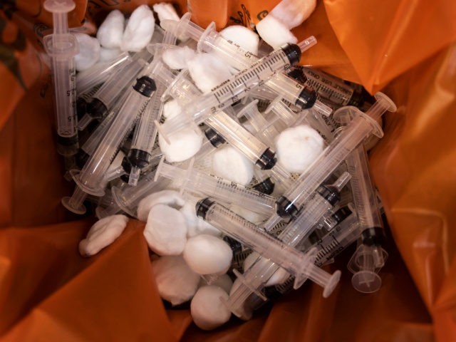 Discarded syringes and cotton balls are seen inside a rubbish bin after being used to administered people with the CoronaVac vaccine developed by Sinovac firm on April 22, 2021 in Phuket, Thailand. Thailand's tourism-driven economy has been battered by the country's borders being closed for a prolonged period, and a …