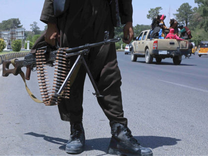 TOPSHOT - A Taliban fighter stands guard on a street in Herat on August 14, 2021. (Photo b